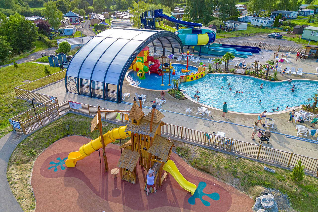 Swimming pool, water slides and playground at CAPFUN Pachy campsite in FOSSES LA VILLE.