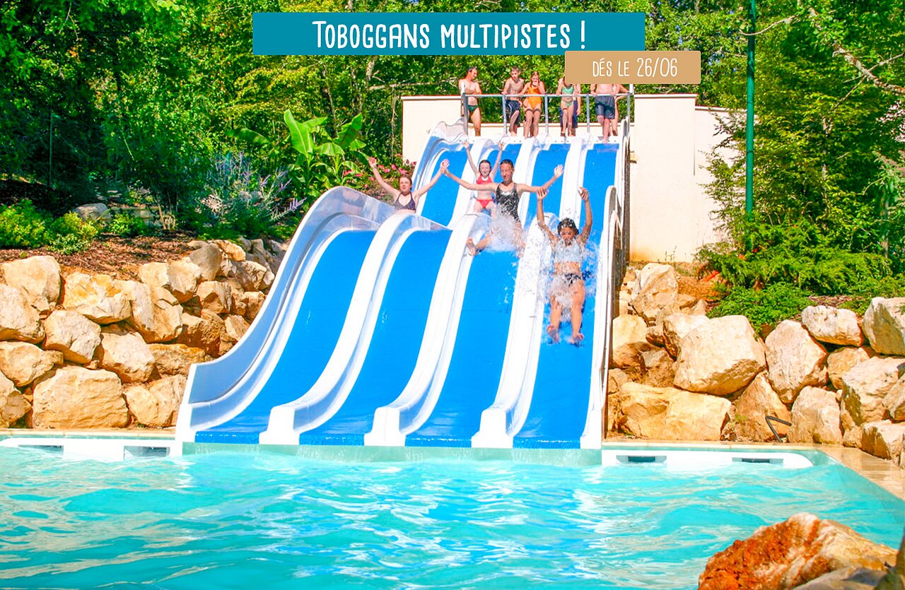 Toboggans multipistes et piscine ext�rieure avec enfants au camping VAGUES OCEANES Paille Basse � Souillac (46).