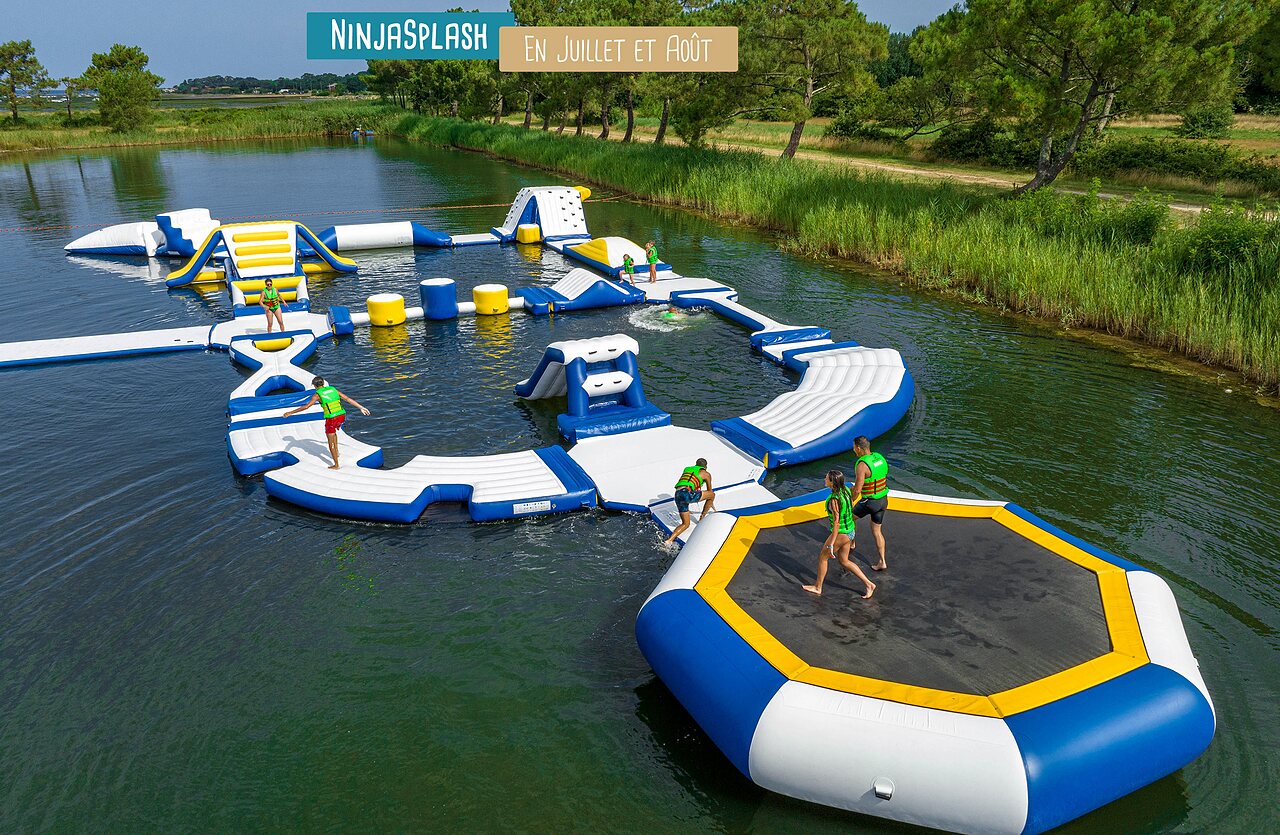 Inflatable water park Ninjasplash on water at VAGUES OCEANES campsite Gouaix.