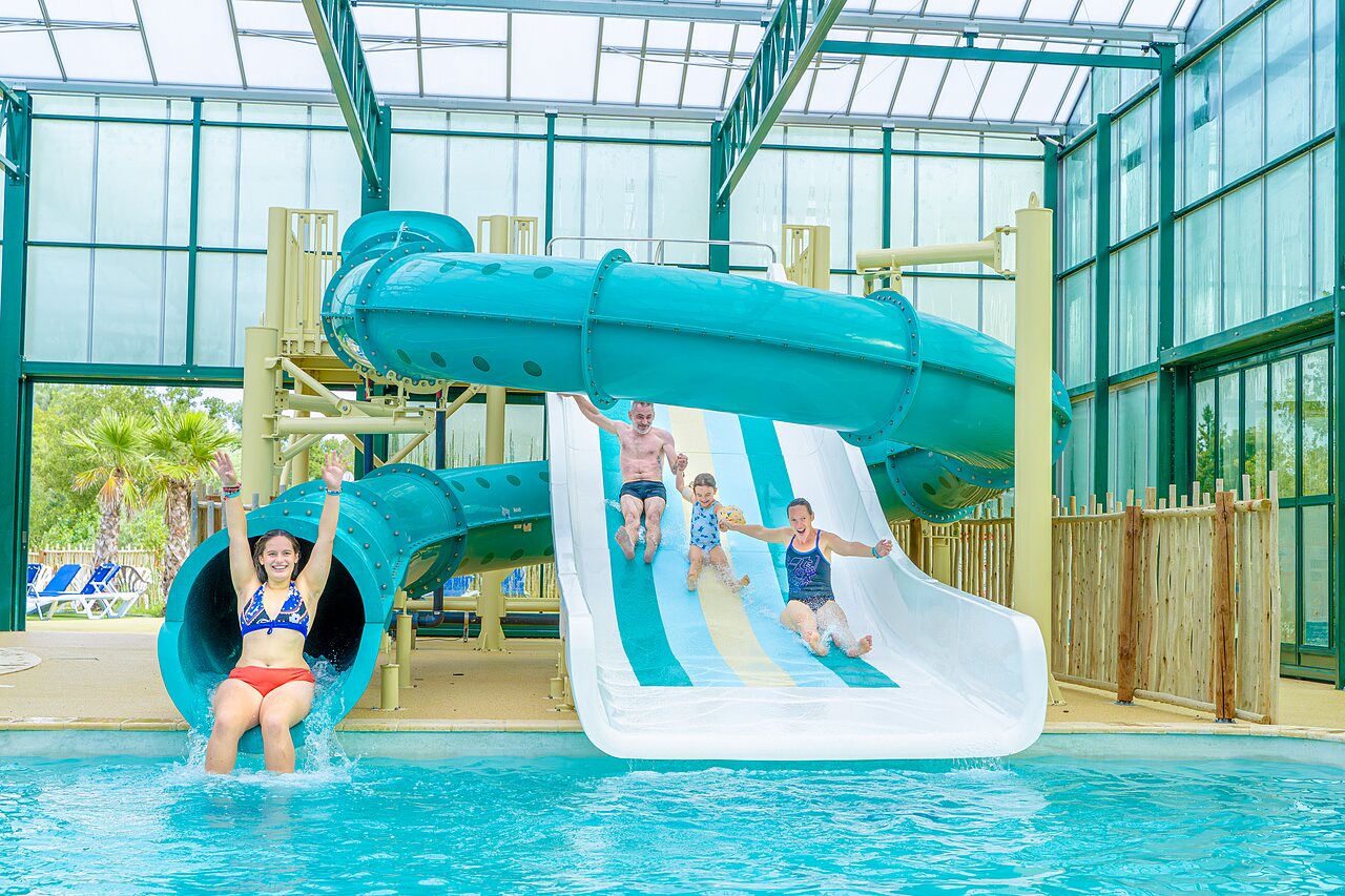 Water slides and indoor pool, family at VAGUES OCEANES campsite Gouaix.