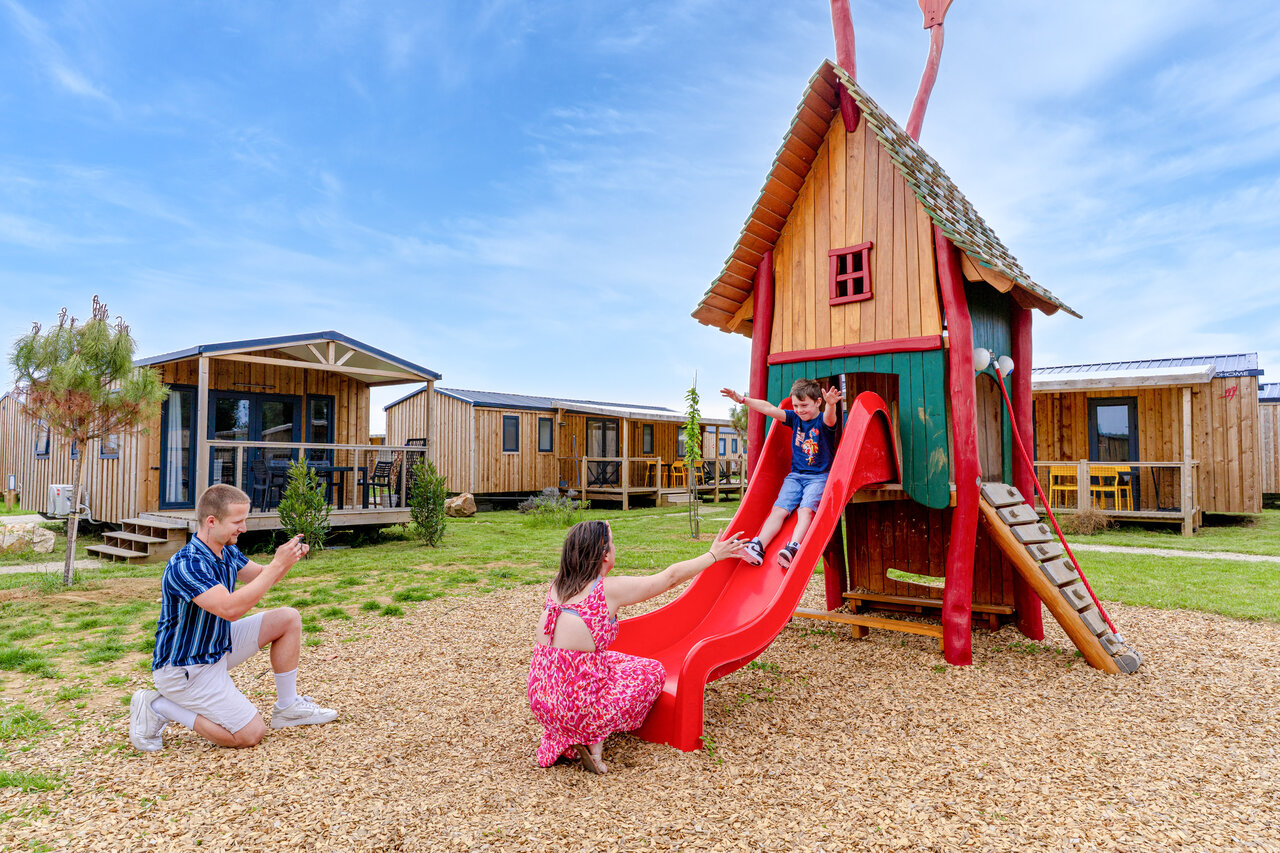 Slide, child, Mobile homes at CAPFUN Le Village Parisien campsite in VARREDDES.